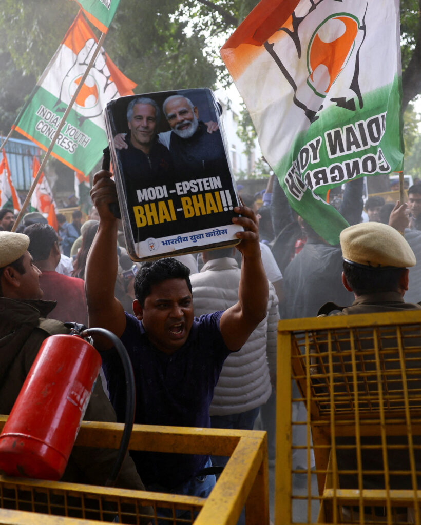 Supporters of the Indian Youth Congress hold placards and flags and shout slogans demanding the resignation of Prime Minister Narendra Modi after his name surfaced in the Epstein files, and against the annual budget, in New Delhi