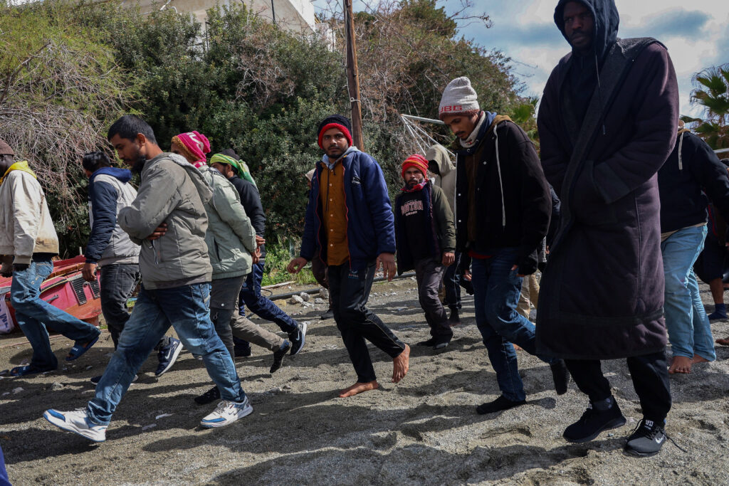 Rescued migrants disembark at Crete port after boat sinking, several dead