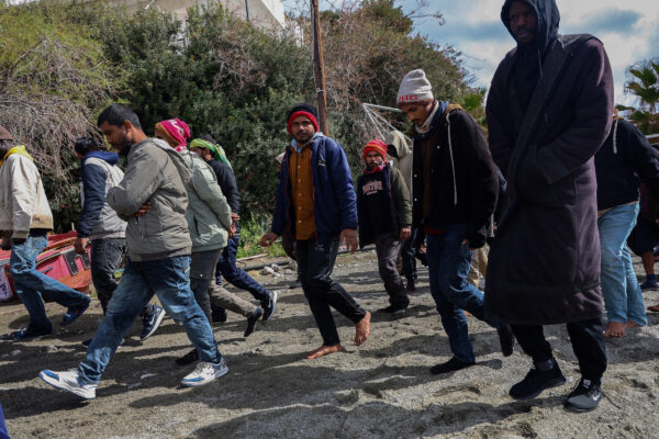 Rescued migrants disembark at Crete port after boat sinking, several dead