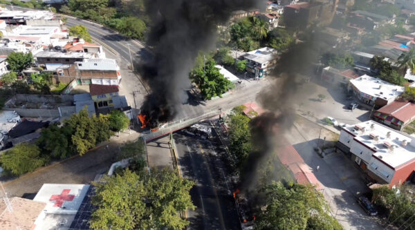 Smoke billows, following a military operation in which a government source said Mexican drug lord Nemesio Oseguera, known as “El Mencho,” was killed, in Puerto Vallarta