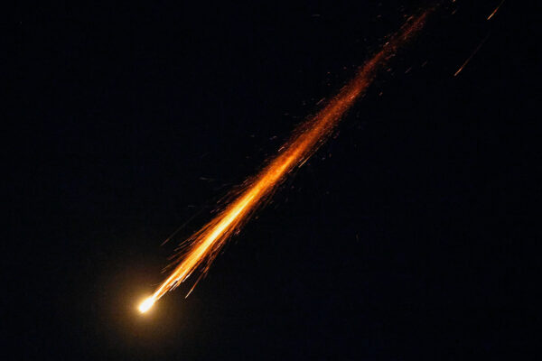 A fragment of a projectile falls from the sky following an interception of an Israeli anti-air defence system as seen from Ashkelon