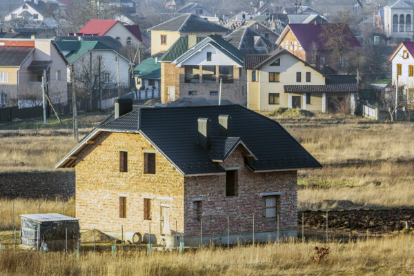 Aerial view of a new modern residential house under construction.