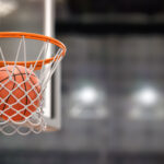 Basketball ball scoring the winning  points on basketball net ho