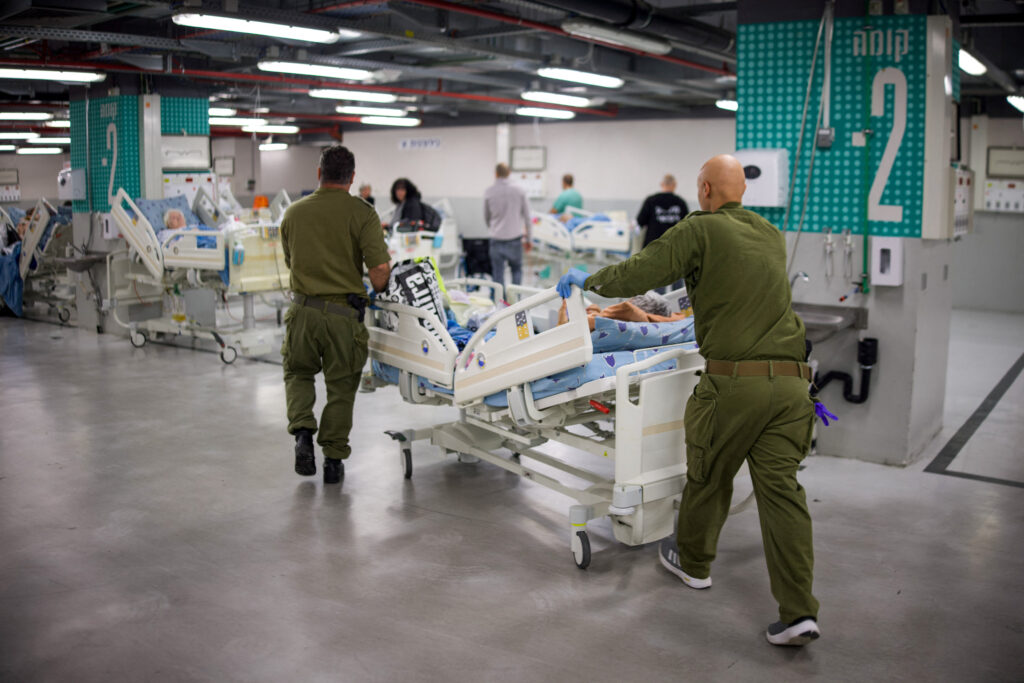 Israeli patients are moved to a sheltered parking facility of the Sourasky Medical Center (Ichilov) in Tel Aviv