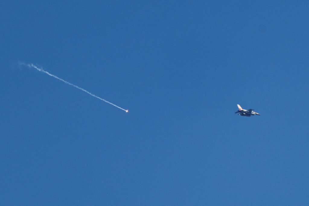An Israeli F-16 releases a flare as it flies near Beit Shemesh