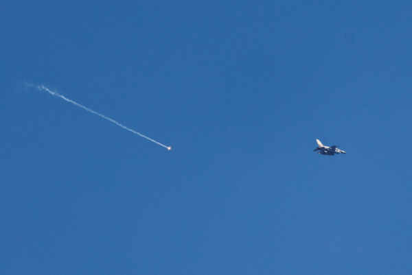 An Israeli F-16 releases a flare as it flies near Beit Shemesh