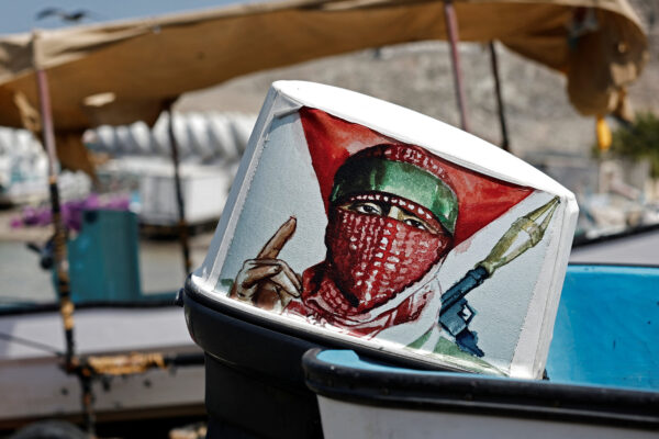 A drawing representing Hamas’s military is stuck on the engine of a boat on Haramil Beach