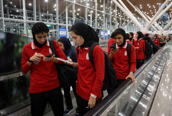 Members of the Iranian women’s national soccer team arrive in Sepang