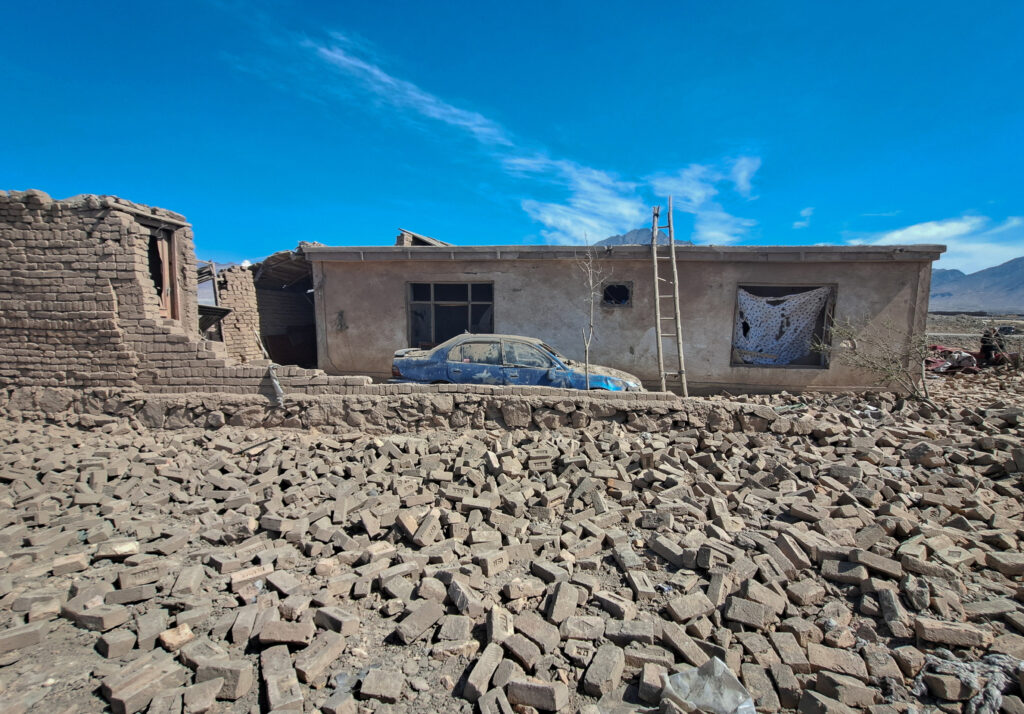 A car stands outside a house damaged in what the Taliban said was a Pakistani air strike on the outskirts of Kabul