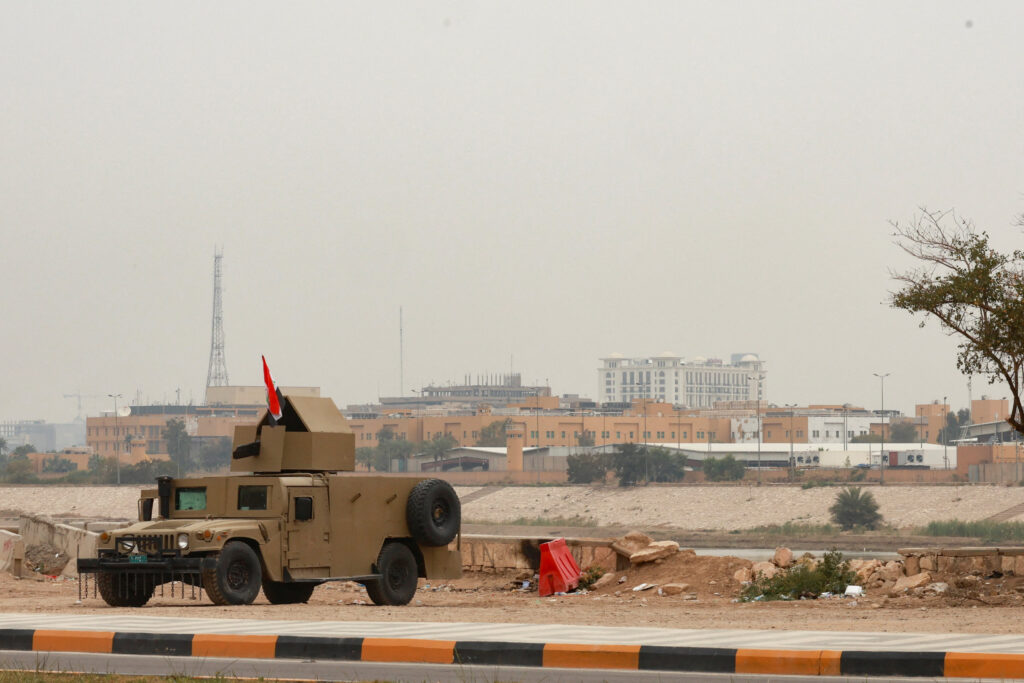 An Iraqi army Humvee stands guard near the U.S. Embassy, in Baghdad