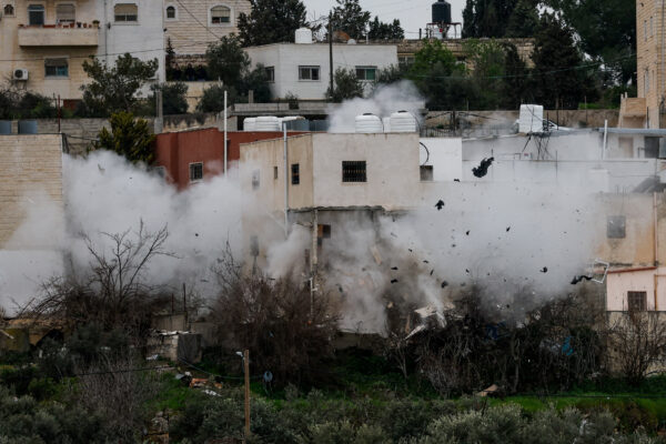 Israeli army demolishes a Palestinian house, in Dura, in the Israeli-occupied West Bank