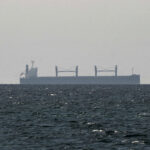 FILE PHOTO: A cargo ship in the Gulf, near the Strait of Hormuz