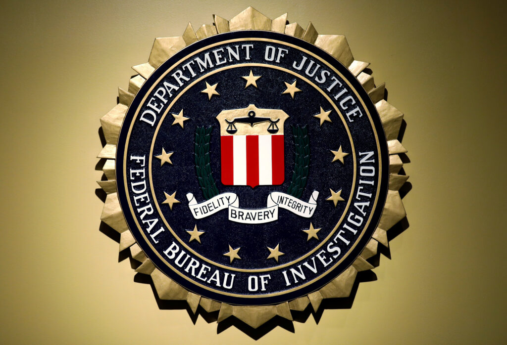 The Federal Bureau of Investigation seal is seen at FBI headquarters before a news conference by the FBI Director the inspector general’s report in Washington