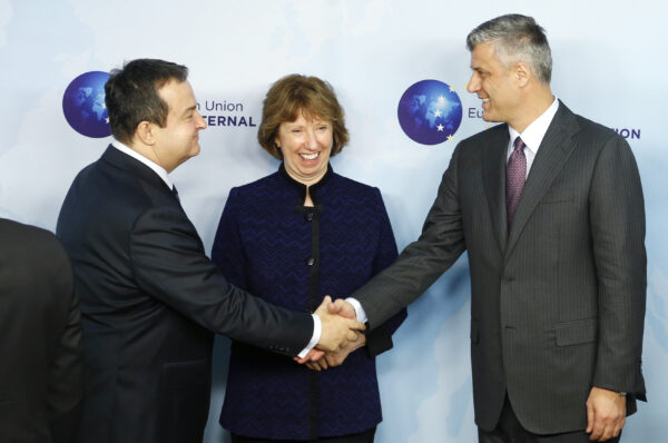 Serbian PM Dacic shakes hands with Kosovo’s PM Thaci during a joint meeting with EU foreign policy chief Ashton in Brussels