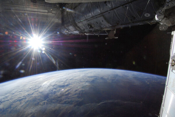 FILE PHOTO: The sun is captured over Earth’s horizon by one of the Expedition 36 crew members aboard the International Space Station