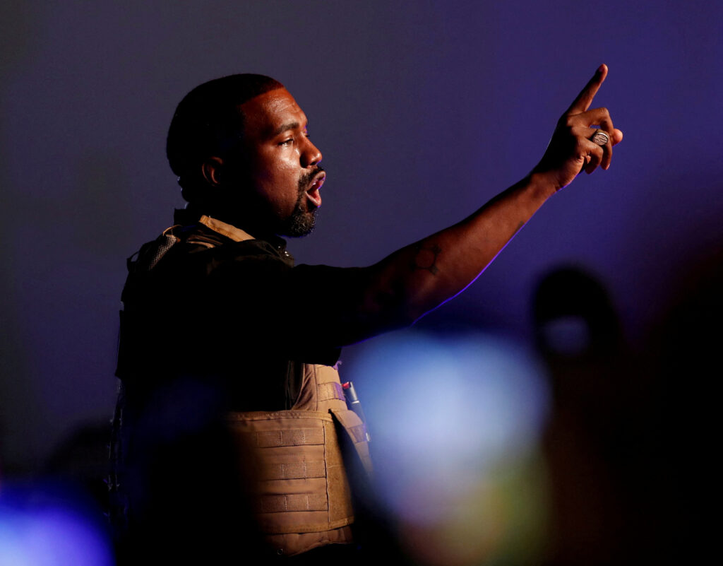 FILE PHOTO: Rapper Kanye West gestures to the crowd