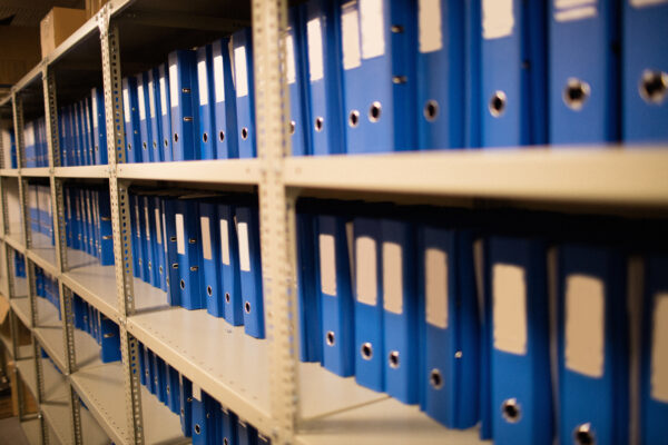 blue-files-arranged-on-shelves-in-storage-room-2026-03-26-11-48-16-utc