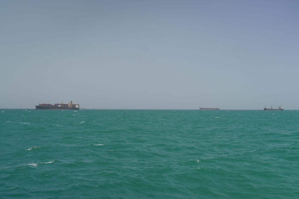 Cargo ships sail in Saudi waters near the Dammam Port in Dammam