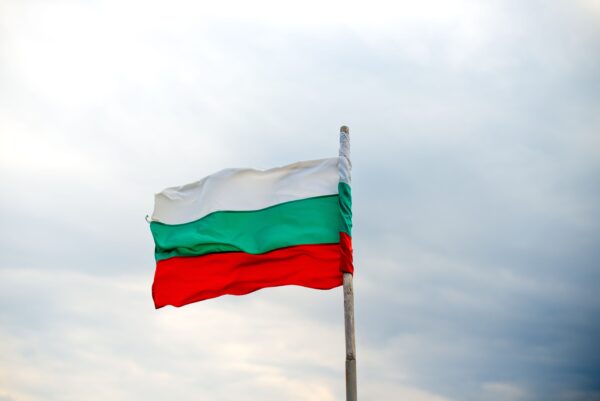 Bulgarian flag against a cloudy sky