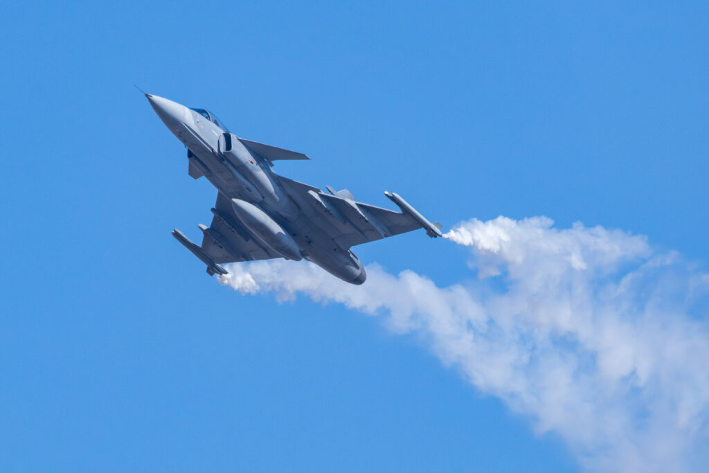 Military Fighter Jet Performing Aerobatic Flight Maneuver