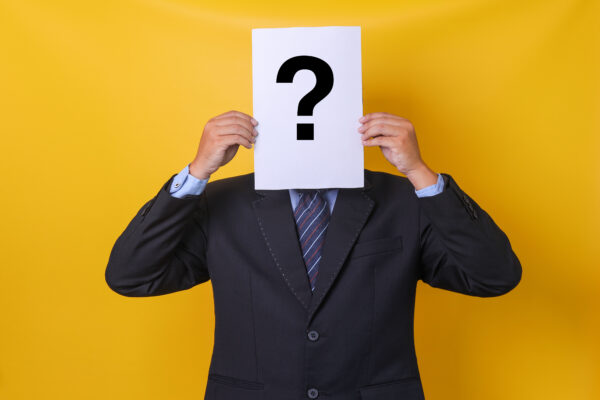 unknown-man-holding-question-mark-over-face-2026-03-18-04-24-02-utc