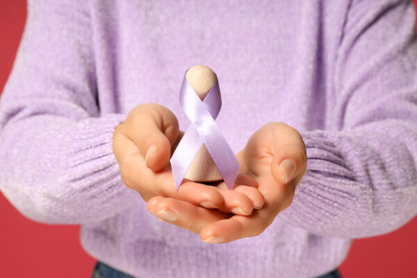 The concept of eliminating violence against women purple ribbon