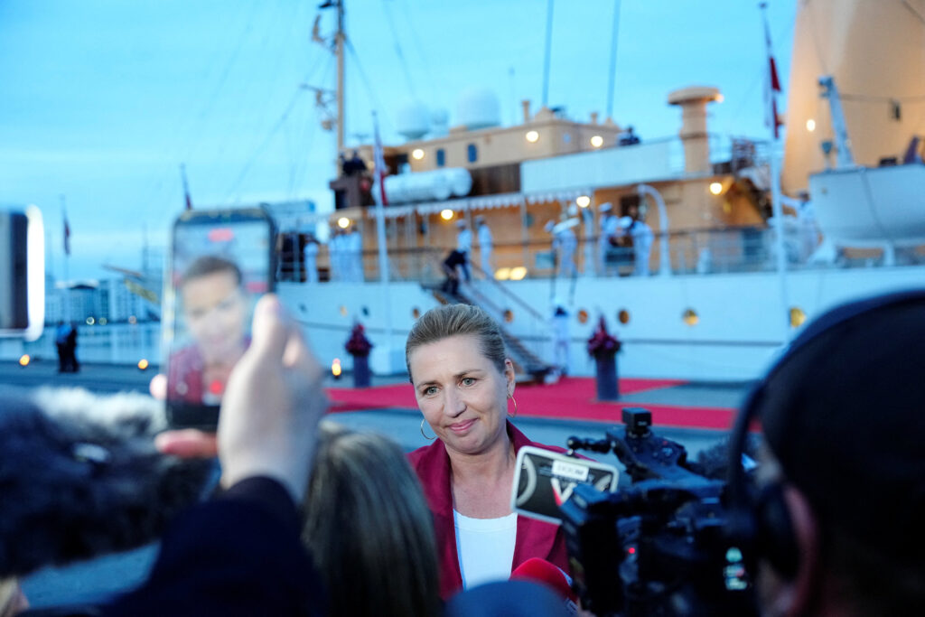 Denmark’s acting Prime Minister Mette Frederiksen speaks to the media near the royal yacht Dannebrog, docked at Odense Harbor