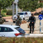 Israeli emergency services work at the scene of what Israeli police say was a series of shooting attacks in central Israel