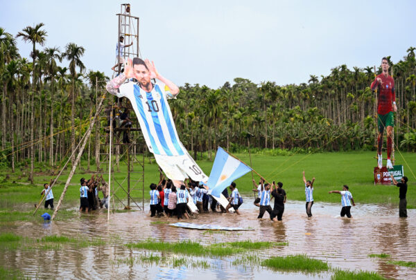 Indian fans celebrate the 2026 FIFA World Cup with cutouts of soccer stars in Kozhikode