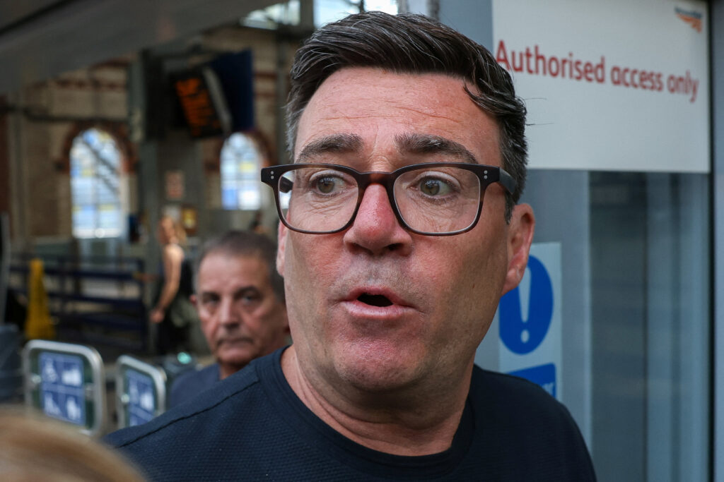 Newly elected Makerfield MP and former Greater Manchester Mayor Andy Burnham at Manchester Piccadilly station as he leaves for London