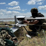 FILE PHOTO: Ukrainian serviceman prepares to launch a Hornet middle strike drone towards Russian troops from a position near a front line in Donetsk region