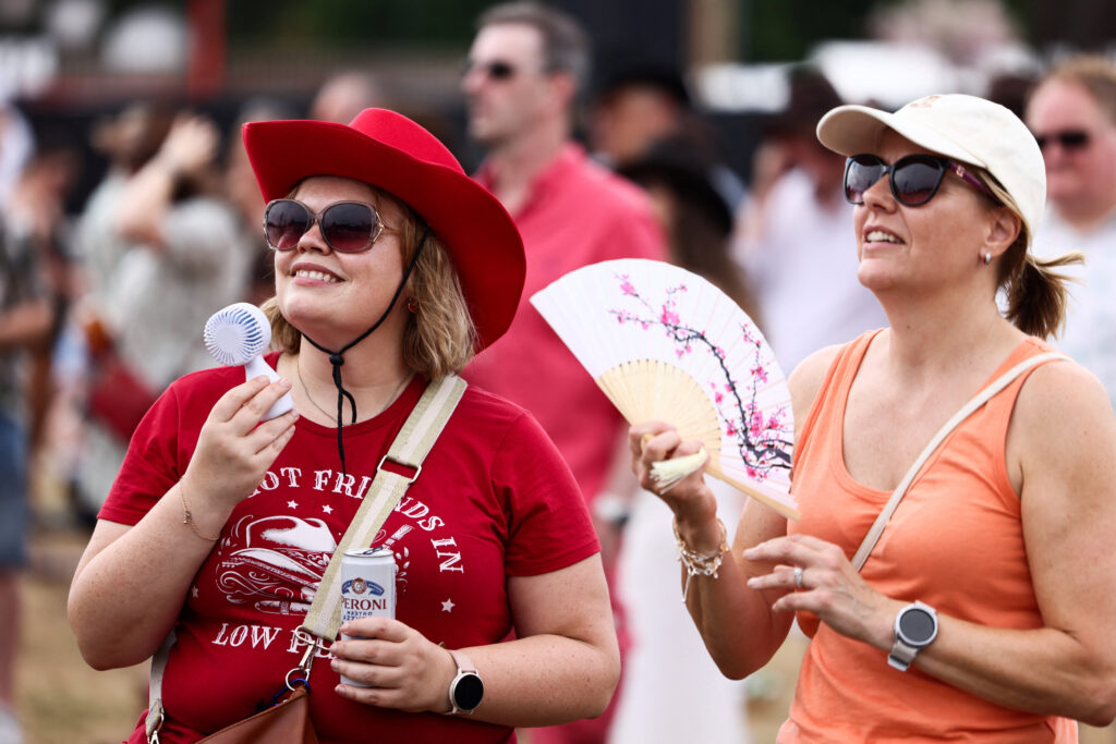 Country music fans on the first day of BST Hyde Park as an amber extreme heat warning remains in place over southeast England
