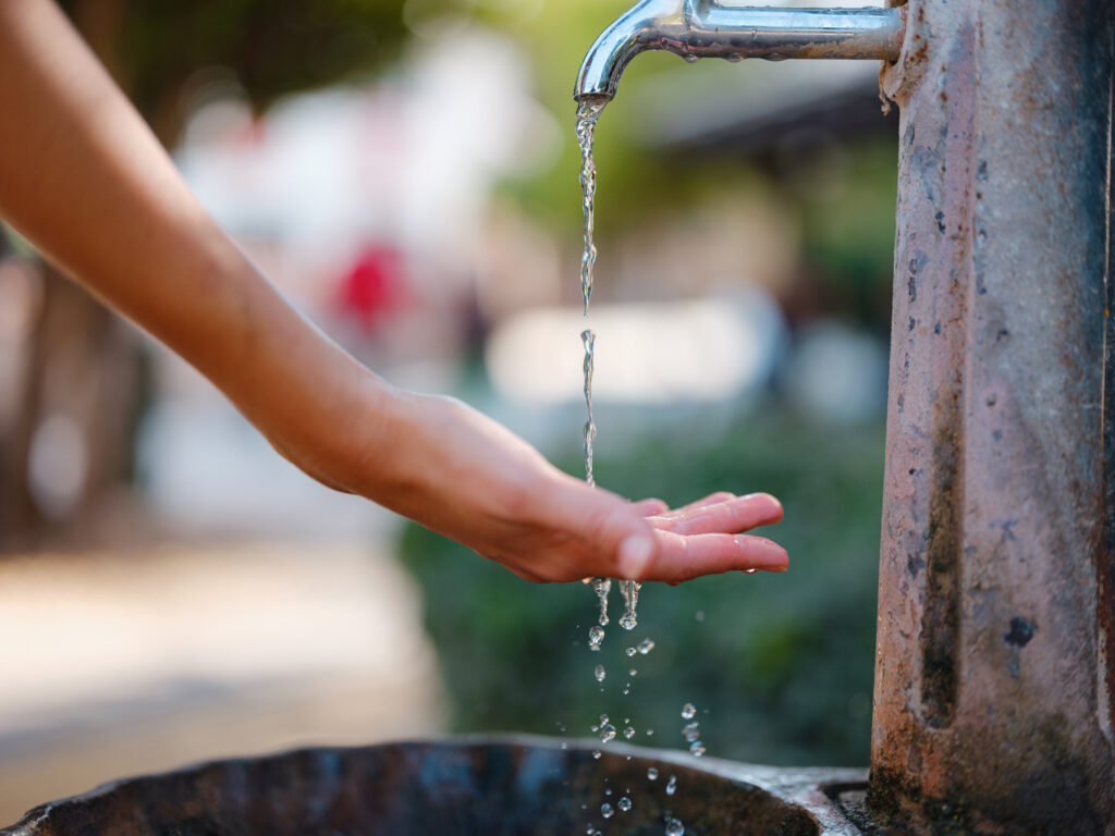 Antalyas old town: female hand and water