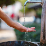 Antalyas old town: female hand and water