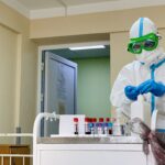doctor-in-a-protective-medical-suit-and-mask-works-2026-03-18-13-50-27-utc