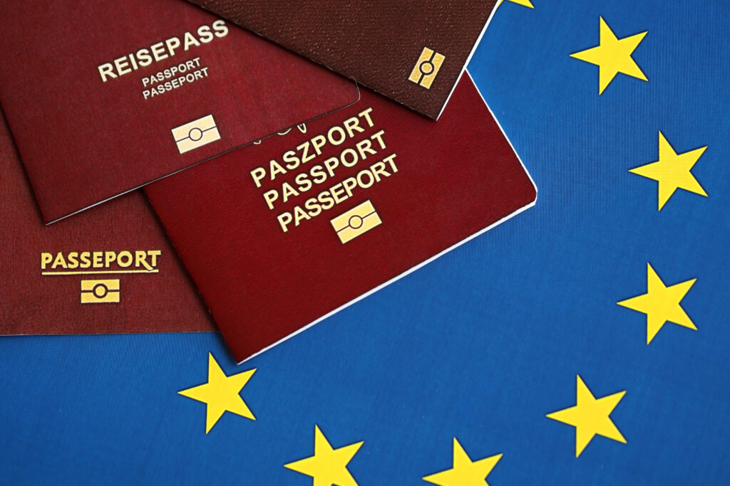 European union countries passports on blue EU flag close up