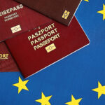 European union countries passports on blue EU flag close up