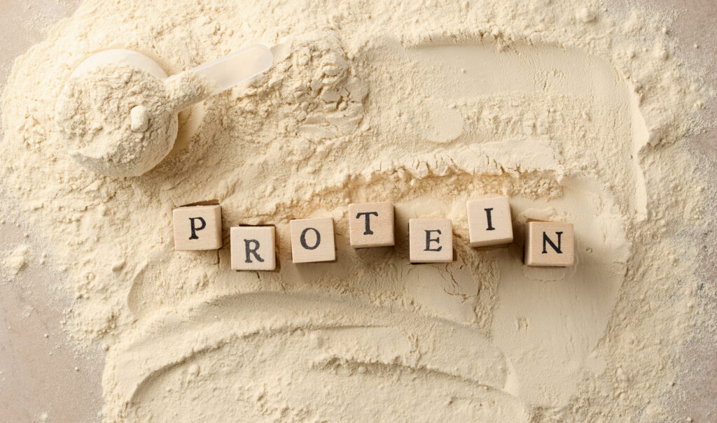 vegan protein powder with wooden letters
