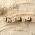 vegan protein powder with wooden letters