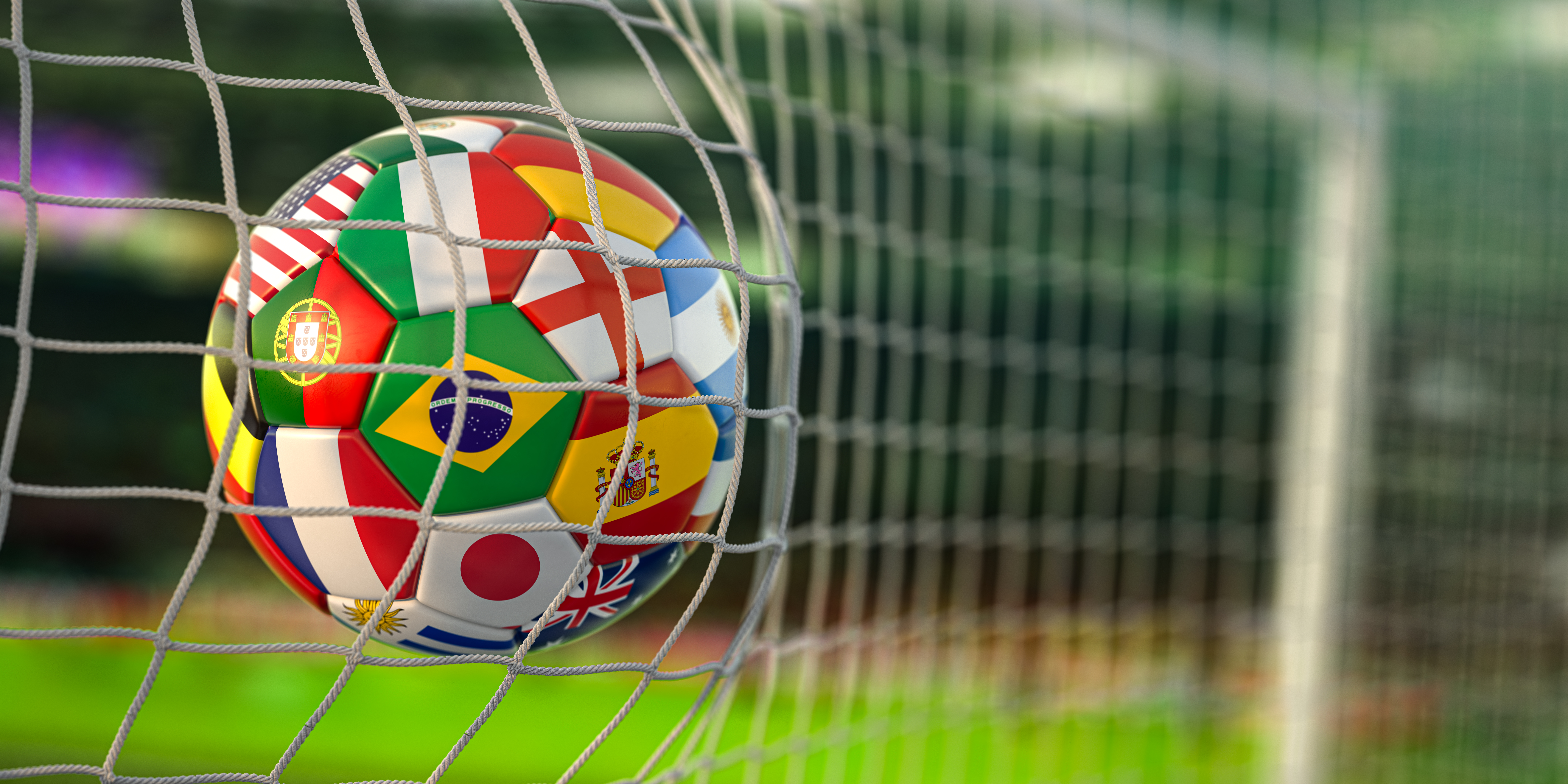Football ball with flags of world countries in the net of goal o
