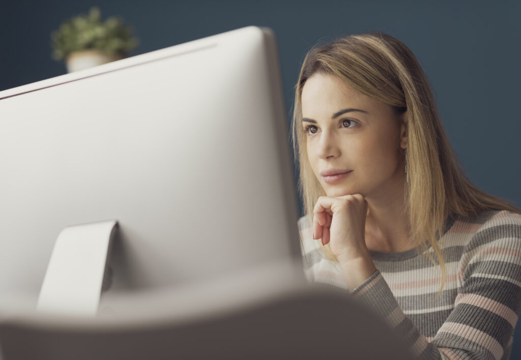 Young attractive woman working with a computer