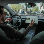 FILE PHOTO: Tesla enthusiast Kees Roelandschap drives around hands-free with his electric car in the city of Amsterdam