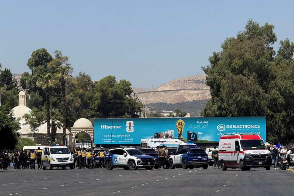 Explosive devices blow up near a hotel where French President Emmanuel Macron was meant to be staying, in Damascus