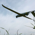 Ukrainian service member looks at a Shark reconnaissance drone as it launches from a position near a front line in Southern Ukraine