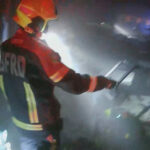 Rescue workers at the site of a deadly fire at a pub in Bangkok