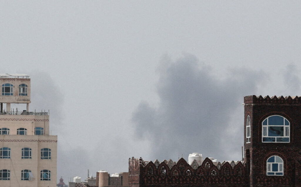 Smoke rises after an airstrike hit the Sanaa International Airport