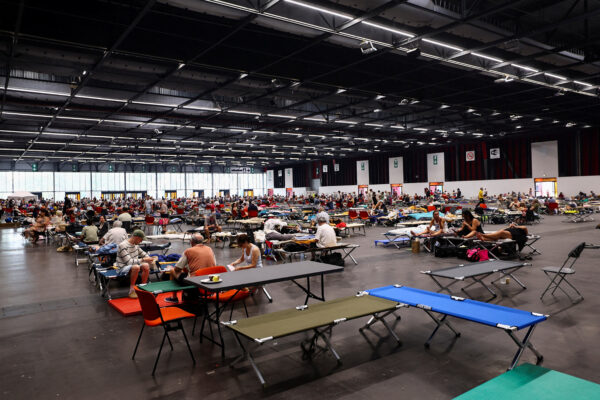 FILE PHOTO: Evacuated residents rest at the Bordeaux-Lac Exhibition Centre, in Bordeaux