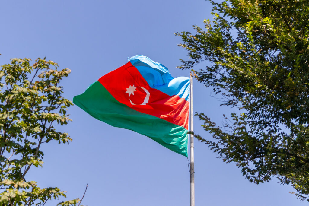 Azerbaijani flag waving in the wind on a sunny day