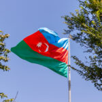 Azerbaijani flag waving in the wind on a sunny day