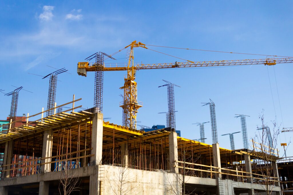 crane-and-building-under-construction-on-a-sunny-d-2026-03-16-02-12-26-utc